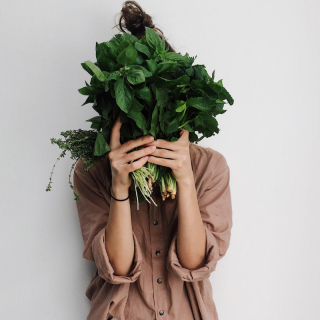 lady holding spinach