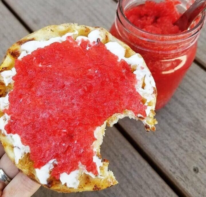 strawberry jam and cream on a scone