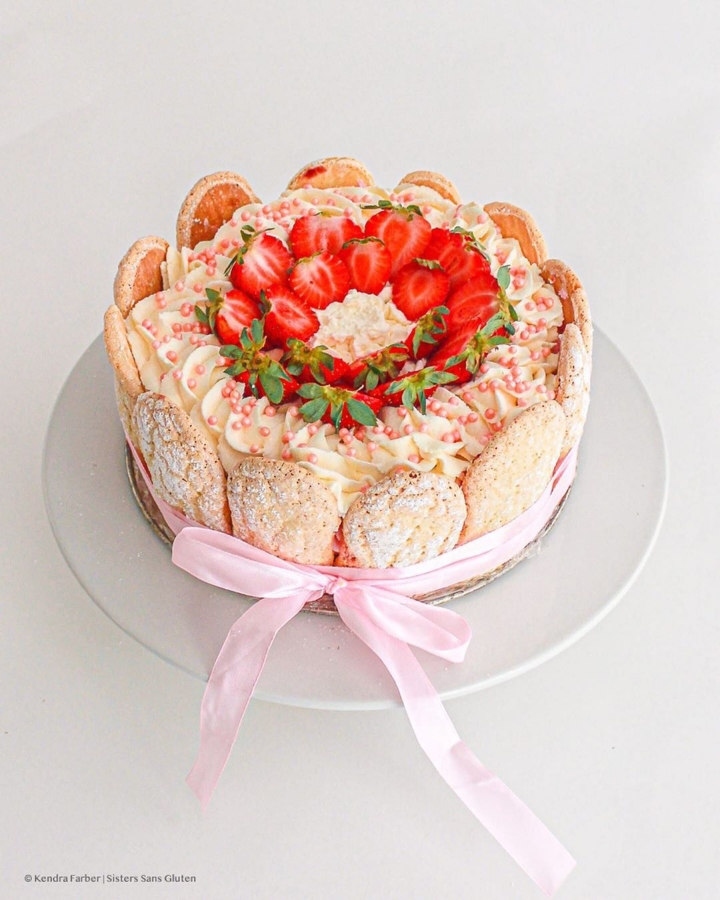 pink charlotte cake with strawberries
