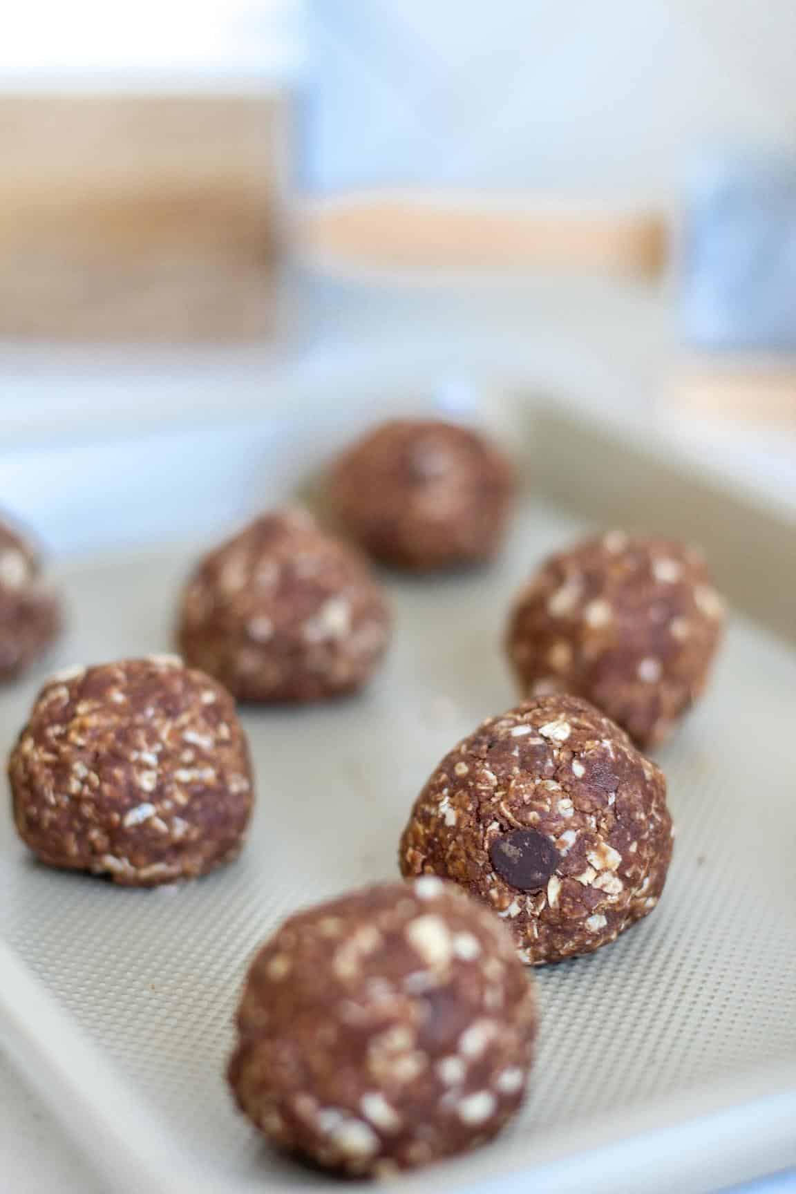 Chocolate Peanut Protein Bites closeup on pan